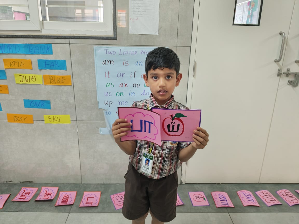 Class 1 and 2 students participated in a fun-filled Tamil letters identification activity. Teachers guided the children to recognize and read the Tamil words.